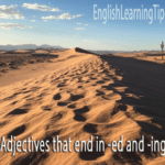 A desert landscape with the text "Adjectives that end in -ed and -ing" and the EnglishLearningTips.com logo.