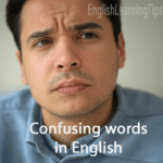A confused man looking at a list of commonly confused English words like affect vs effect and its vs it's.