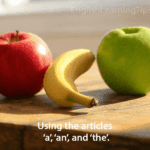 A banana and an apple on a table illustrating the use of English articles a and an.