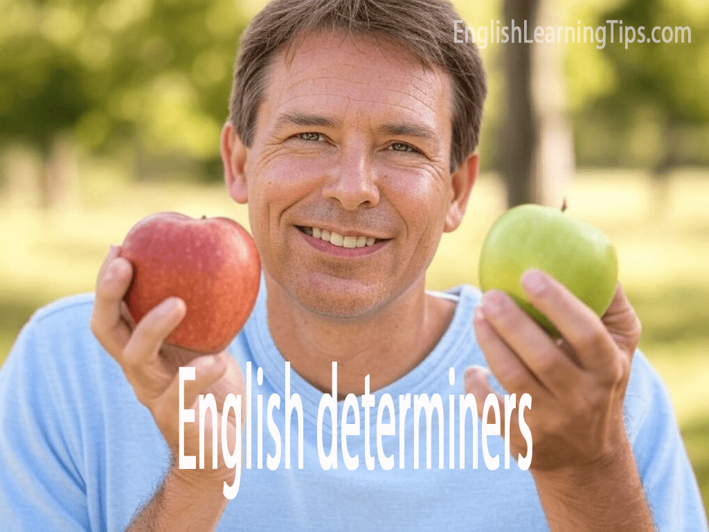 Man holding two different apples to demonstrate determiners