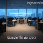 An empty modern office at night with city lights in the background and text overlaying that says "Idioms for the Workplace" and the website "EnglishLearningTips.com."
