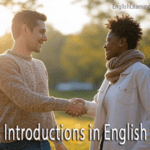 A man and a woman smiling and shaking hands during an introduction in a park setting.