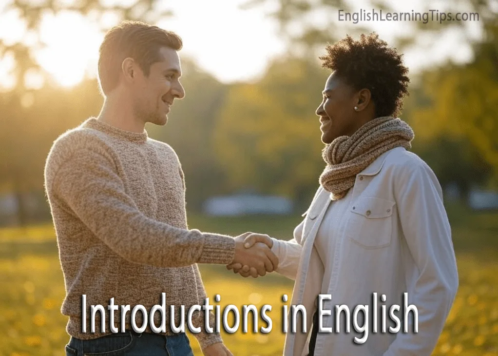A man and a woman smiling and shaking hands during an introduction in a park setting.