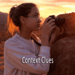 A young woman with glasses using a camera to focus on a desert landscape, used as a metaphor for focusing on context clues in a text.