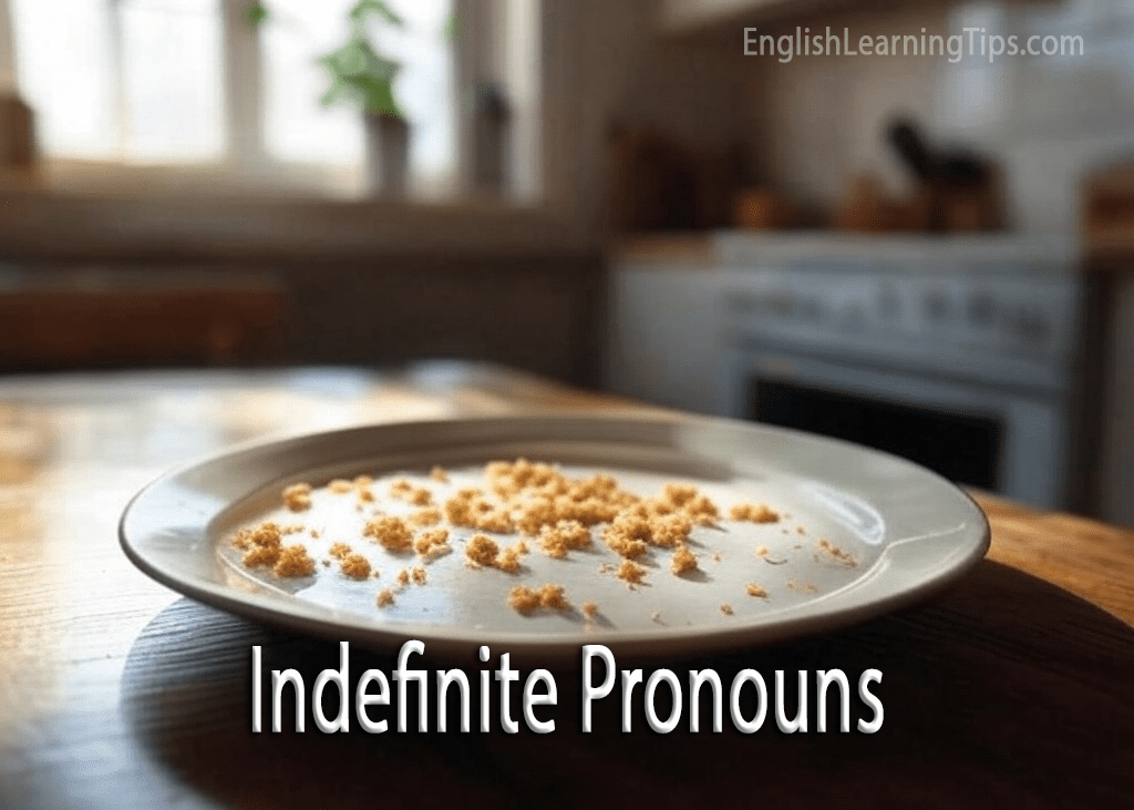 A plate with crumbs on a kitchen table used as a visual metaphor for indefinite pronouns like "something" or "anything."