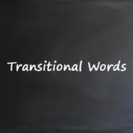 A dark chalkboard featuring the text "Transitional Words" written in a white, handwritten-style font.