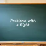A green classroom chalkboard with the text "Problems with a flight" written in the center.