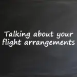 A chalkboard background with the text "Talking about your flight arrangements" written in white.