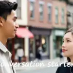 Two people looking at each other on a city street engaging in a conversation to practice speaking English