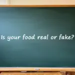 A classroom chalkboard with the text "Is your food real or fake?" written on it.